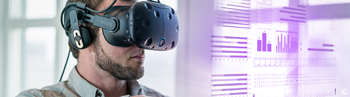 Man wearing a Vive VR headset and viewing a hollographic data visualization.